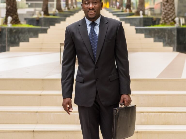 full-length-portrait-of-handsome-african-businessm-2023-11-27-05-12-46-utc_High